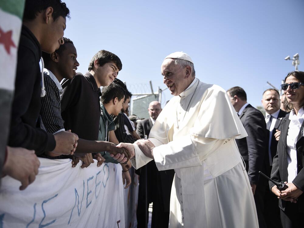 In this handout image provided by Greek Prime Minister's Office, Pope Francis meets migrants at the Moria detention centre on April 16, 2016 in Mytilene, Lesbos, Greece.