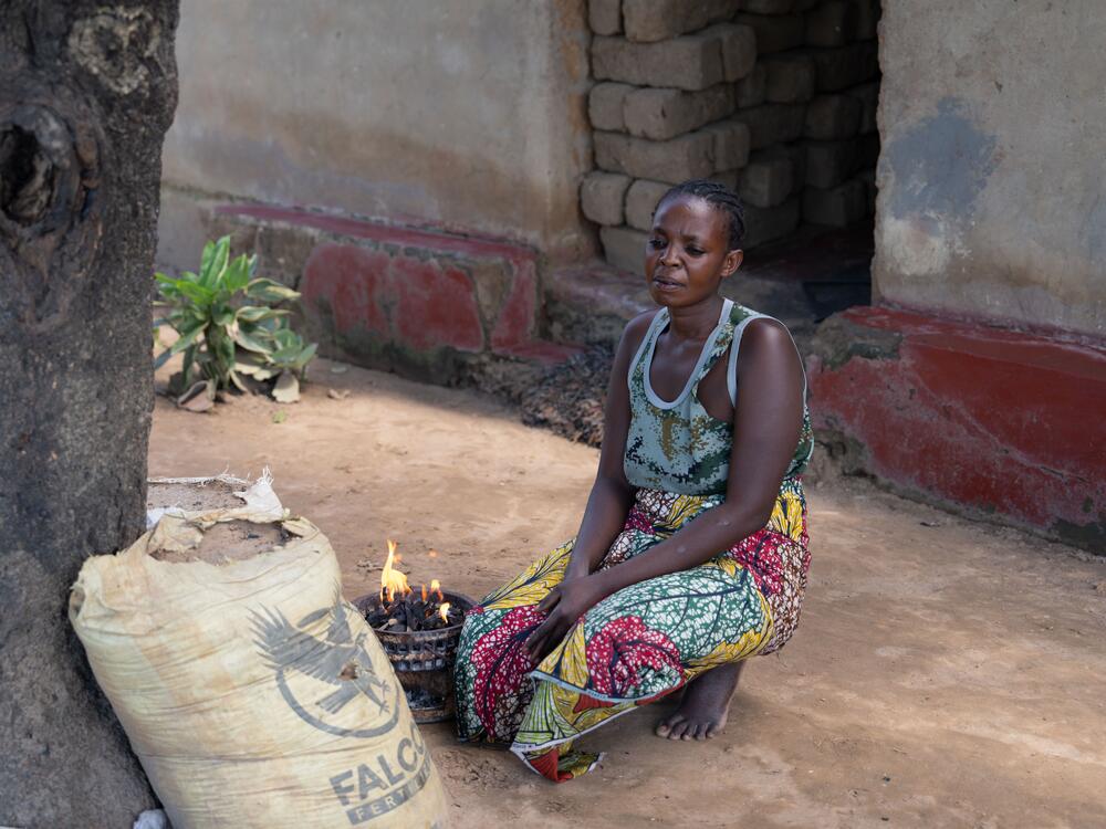 Before medication became available for free with help with the U.S., Theresa Mwanza's two sisters died of AIDS.