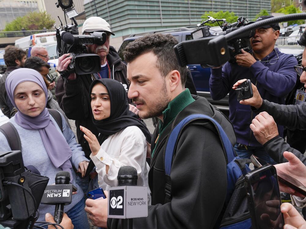 Mahmoud Khalil, center, and his wife Noor Abdalla, left, in violet headscarf, at Columbia University last year.