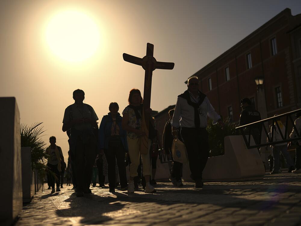 Pilgrims arrive in St. Peter's Square at the Vatican, Tuesday, April 22, 2025.
