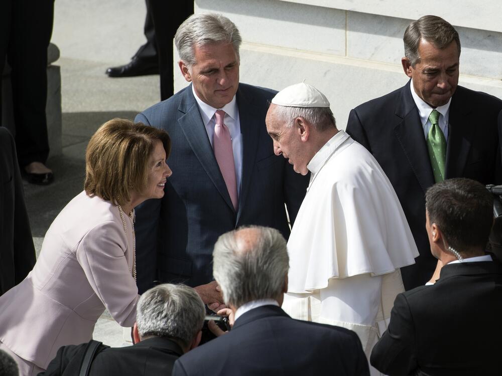 Rep. Nancy Pelosi shakes hands with Pope Francis on Capitol Hill in September 2015.