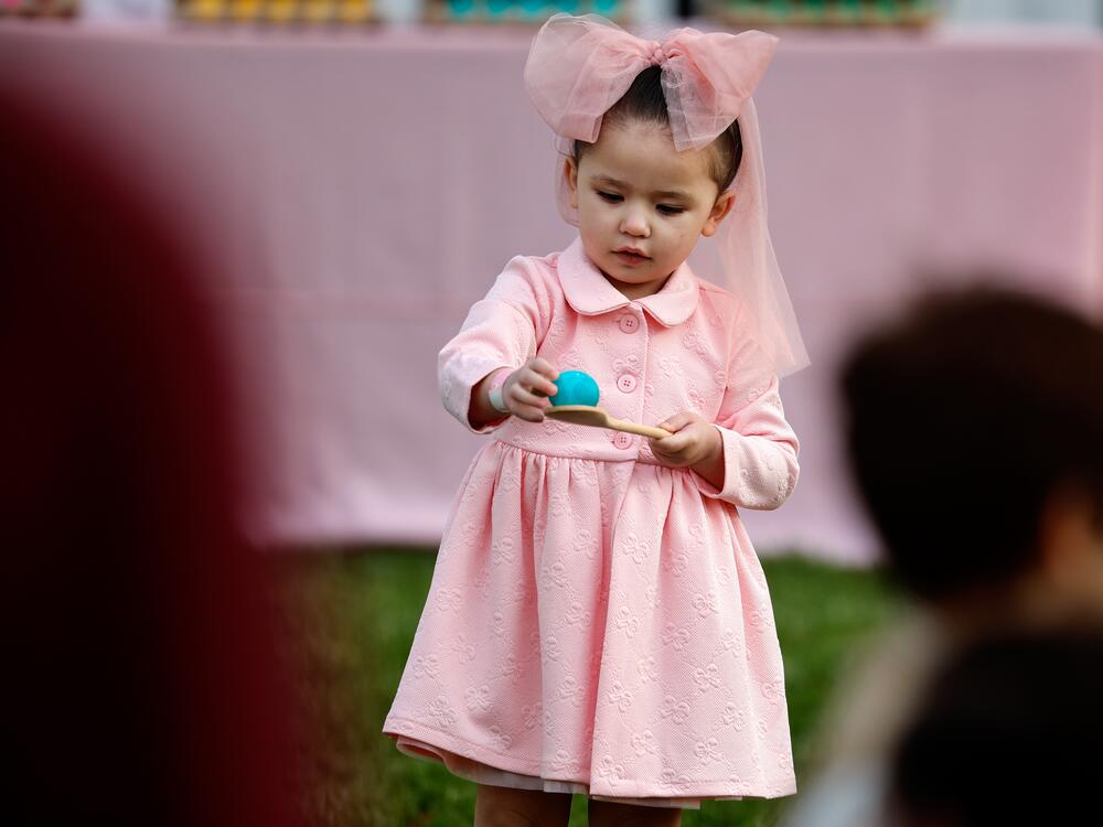 A child balances an egg during the White House Egg Roll on Monday.