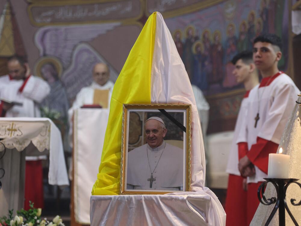 Members of the clergy celebrate Mass for the late Pope Francis at the Holy Family Church in Gaza City on Monday.