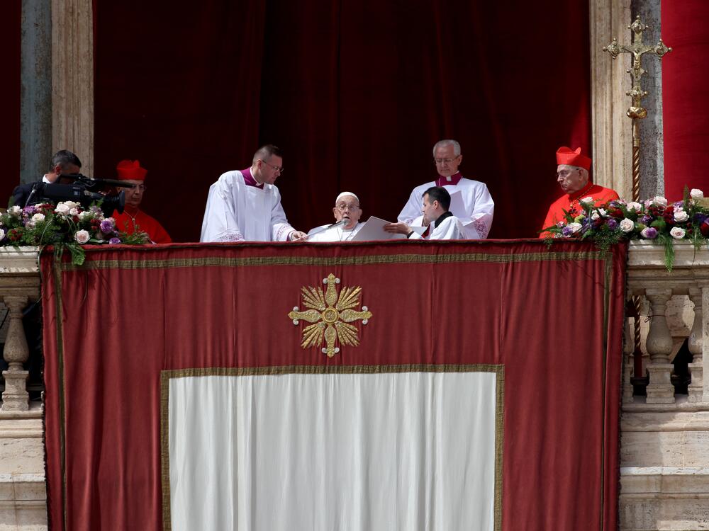 Pope Francis delivers his <em>Urbi Et Orbi</em> blessing from the balcony overlooking St. Peter's Square on April 20 in Vatican City.