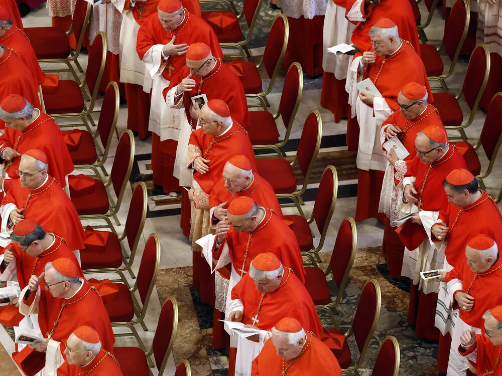 Cardinals look on as the body of Pope Francis is transferred into the Basilica at St Peter's Square in Vatican City on Wednesday. The College of Cardinals is preparing for a conclave to elect the next pontiff, after days of funeral rites and observances conclude.