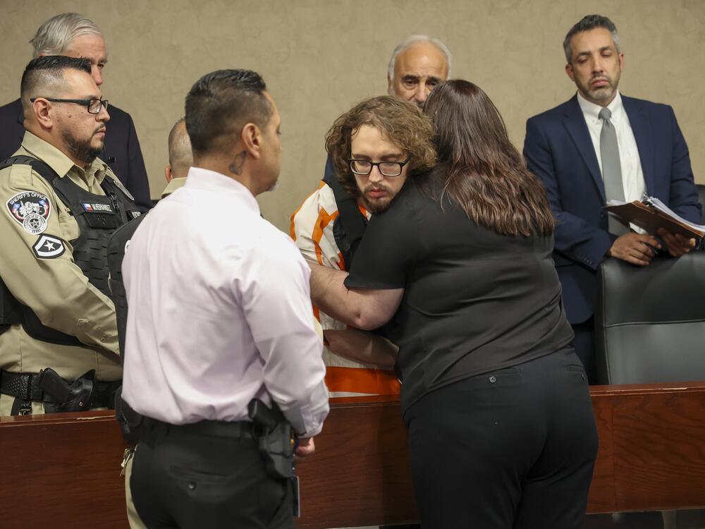 Adriana Zandri, widow of Ivan Manzano killed during the Walmart mass shooting, hugs defendant Patrick Crusius during a plea hearing in El Paso, Texas, Tuesday, April 22, 2025.