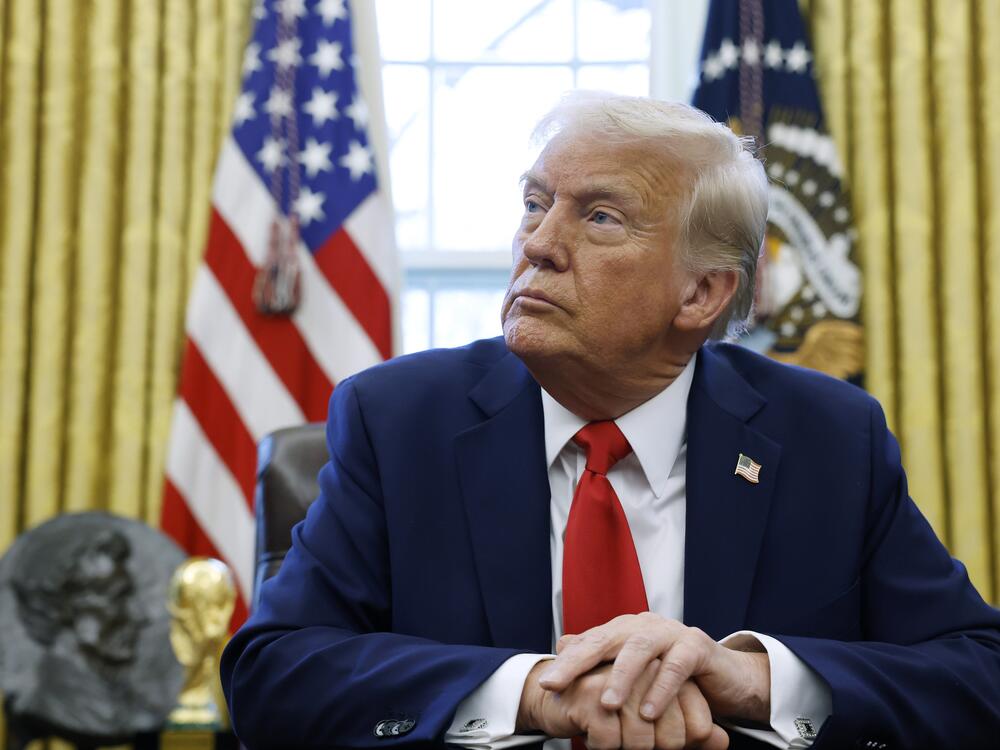 President Donald Trump speaks to reporters in the Oval Office in February.