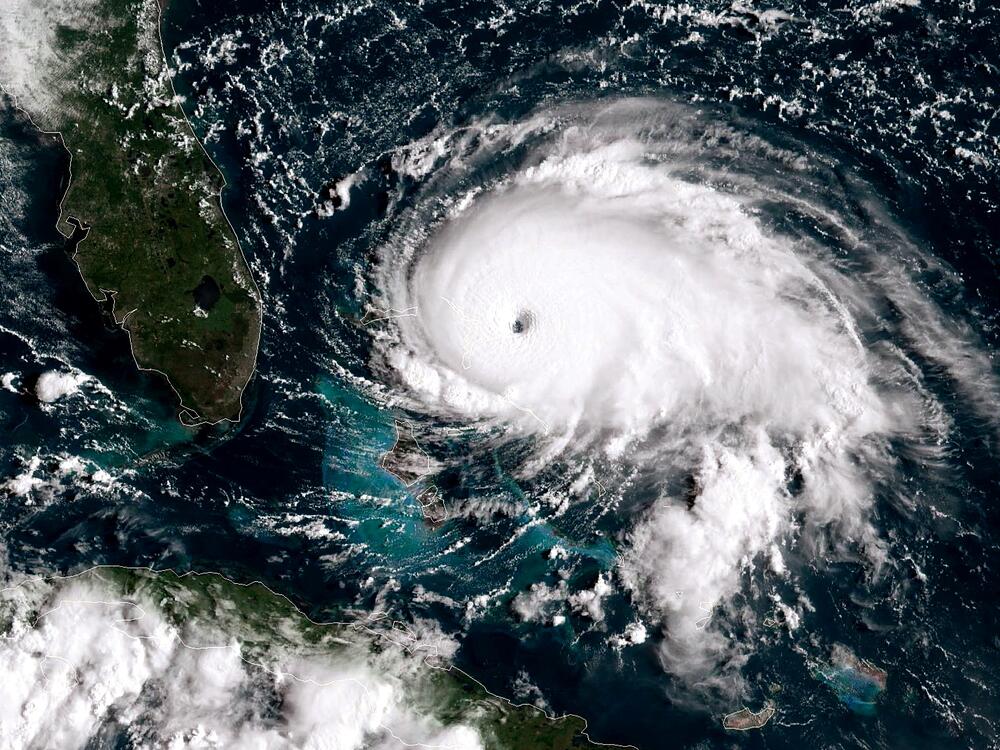Images like this one of Hurricane Dorian taken in 2019 by a NOAA GOES-East satellite show the powerful category 5 storm as it stalled over the Bahamas. Meteorologists use satellites to prepare hurricane forecasts. But proposed funding cuts could eliminate the next-generation of this technology.