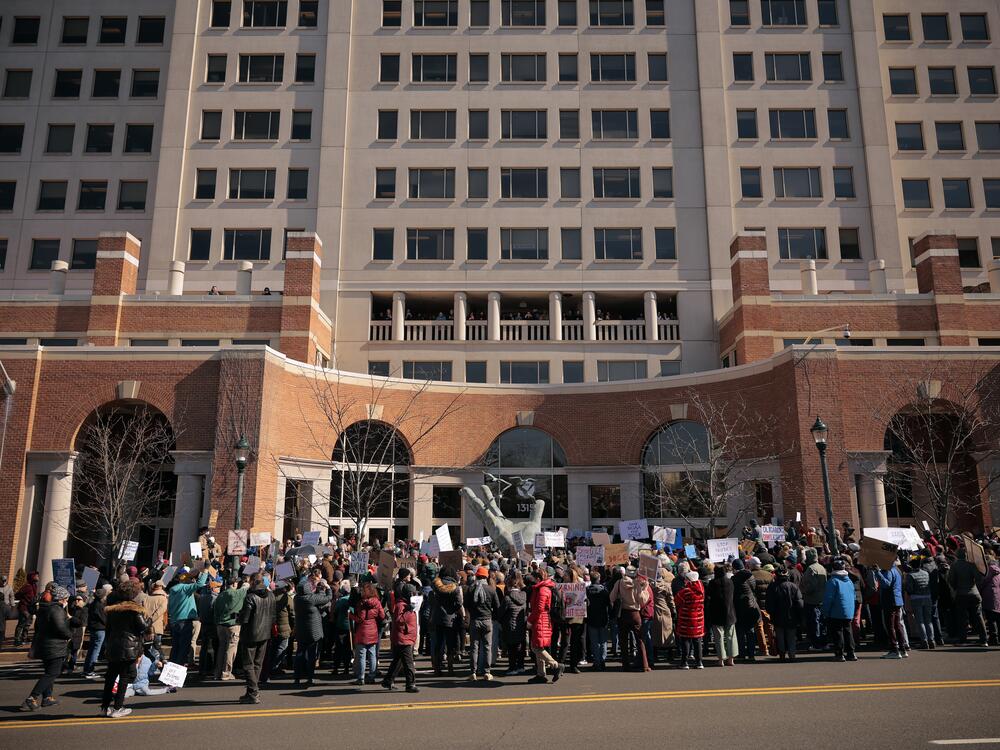 Hundreds of demonstrators protested cuts by the Trump administration outside the headquarters of the National Oceanic and Atmospheric Administration on March 3, 2025, in Silver Spring, Md. The administration fired about 800 probationary staff at NOAA, one of the world's premier centers for climate science. A federal court then ordered the employees to be rehired. Not long after, they were put on administrative leave.