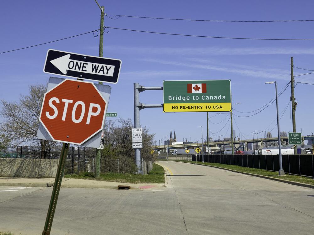 Signs notify drivers at the U.S.-Canada Ambassador Bridge border crossing in Detroit, Michigan.