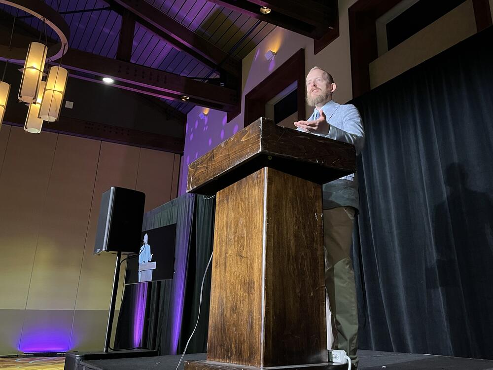 Natal Con's organizer, Kevin Dolan, speaks to attendees in Austin, Texas. He said on his podcast that modern culture and government policies have created a 