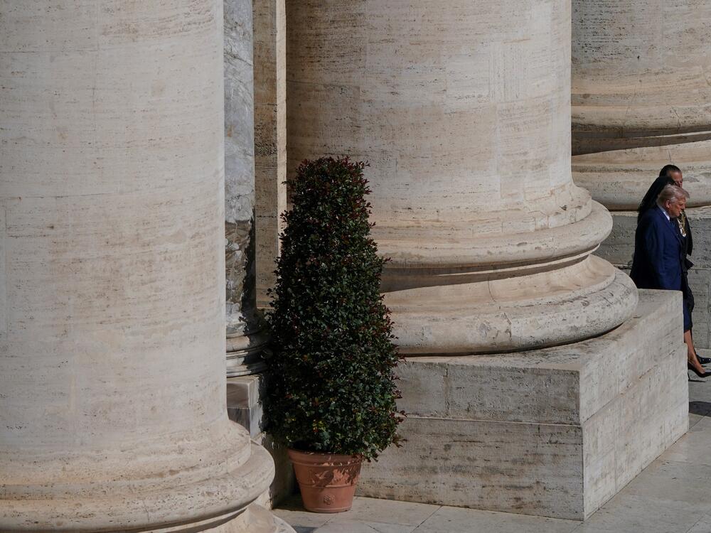 President  Trump walks, on the day of the funeral Mass of Pope Francis.