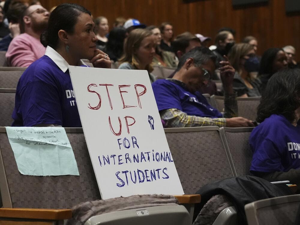 Students and educators attend a rally at Northwestern University one week before the Trump administration said it will restore the records of international students deleted from a crucial database. That move had thrown into doubt many students' ability to stay in the U.S.