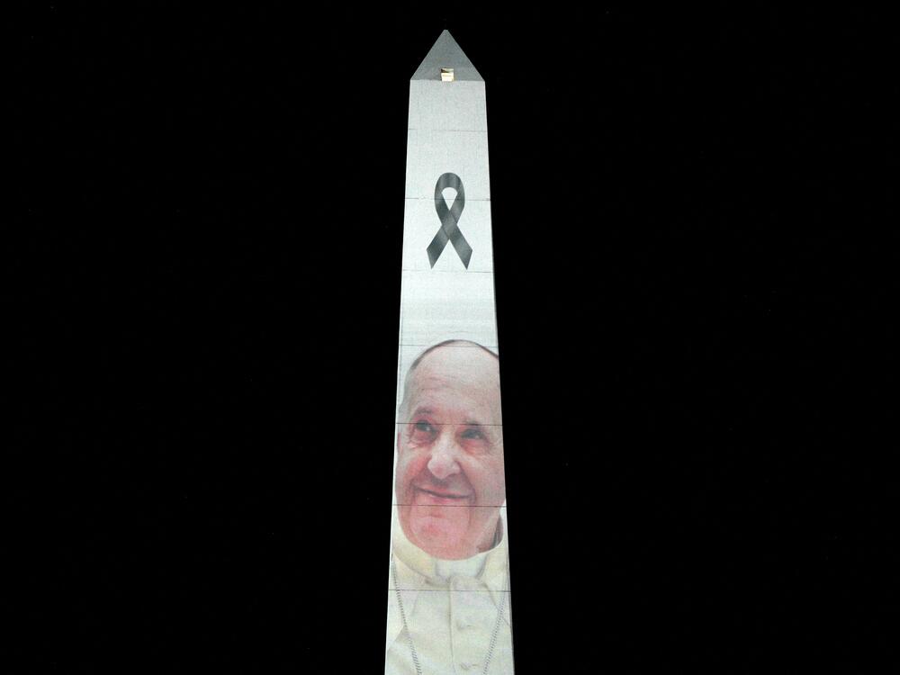 The Obelisk is illuminated with the image of the late Pope Francis at Plaza de la Republica square in Buenos Aires on April 25, 2025, on the eve of his burial to be held at the Vatican. Pope Francis died on April 21, 2025, aged 88.