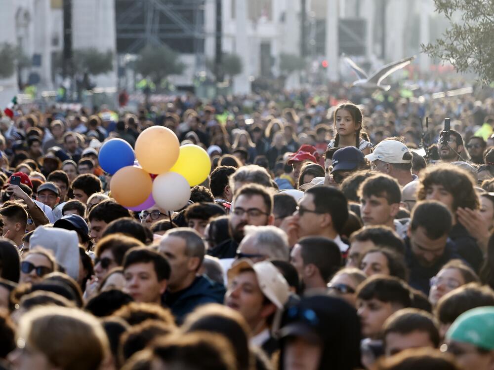 People gather during the funeral of Pope Francis in St. Peter's Square.