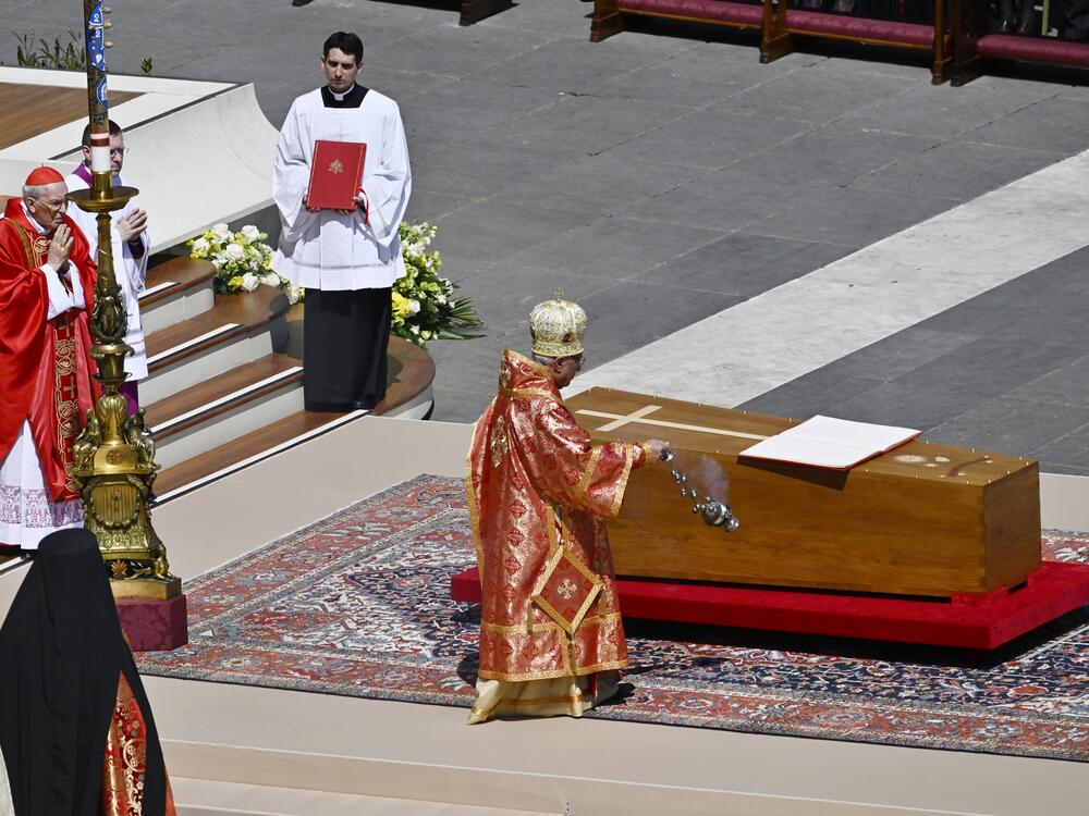 Youssef Absi, Patriarch of Antioch and All the Orient, of Alexandria and of Jerusalem and head of the Melkite Greek Catholic Church, blesses the coffin during the funeral of Pope Francis in St. Peter's Square on Saturday in Vatican City.