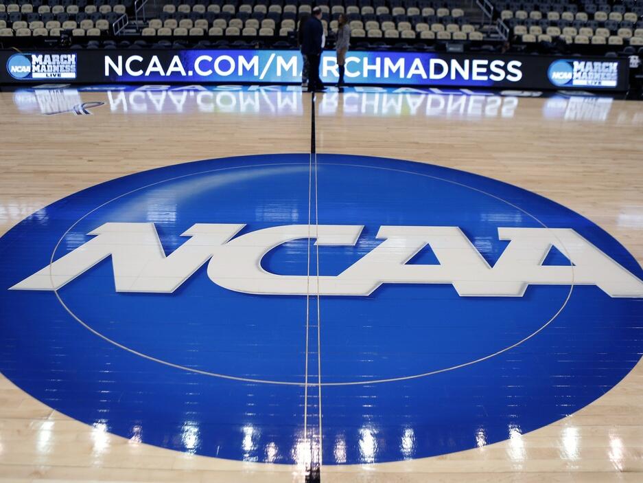 The NCAA logo is displayed in 2015 at center court at The Consol Energy Center in Pittsburgh.