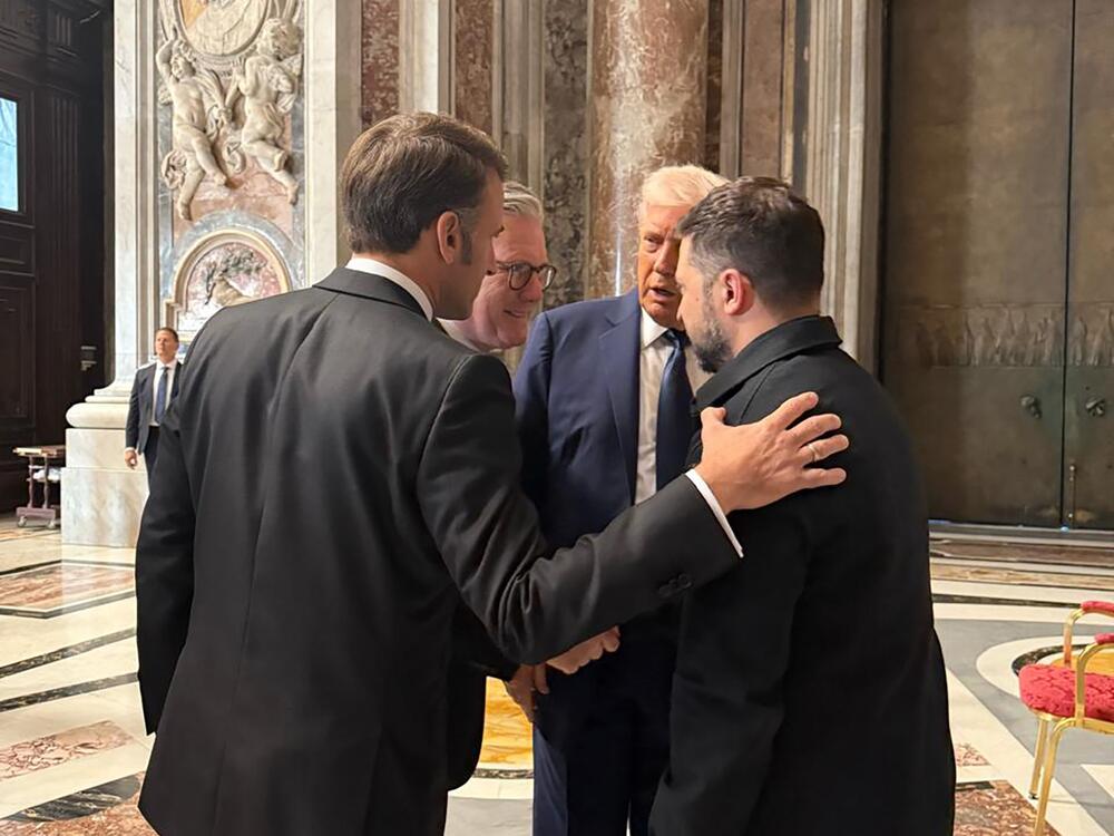Ukraine's President Volodymyr Zelenskyy, right, President  Trump, second right, French President Emmanuel Macron, left, and British Prime Minister Keir Starmer talk as they attend the funeral of Pope Francis.
