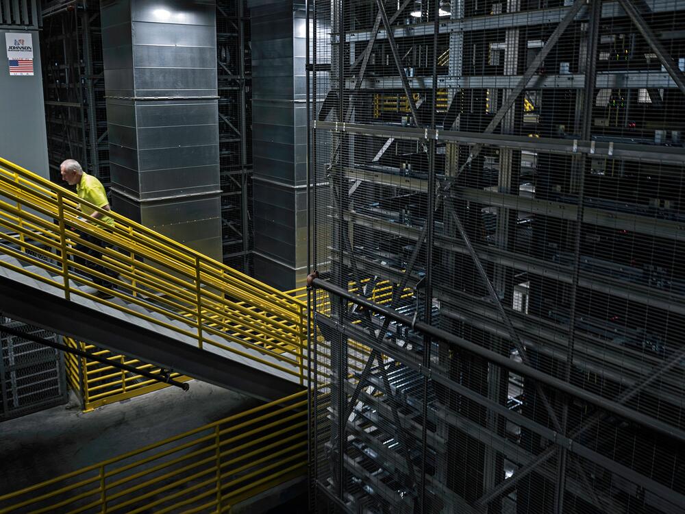 A worker walks through the four-story-tall automated storage and retrieval system in DigiKey's distribution center.