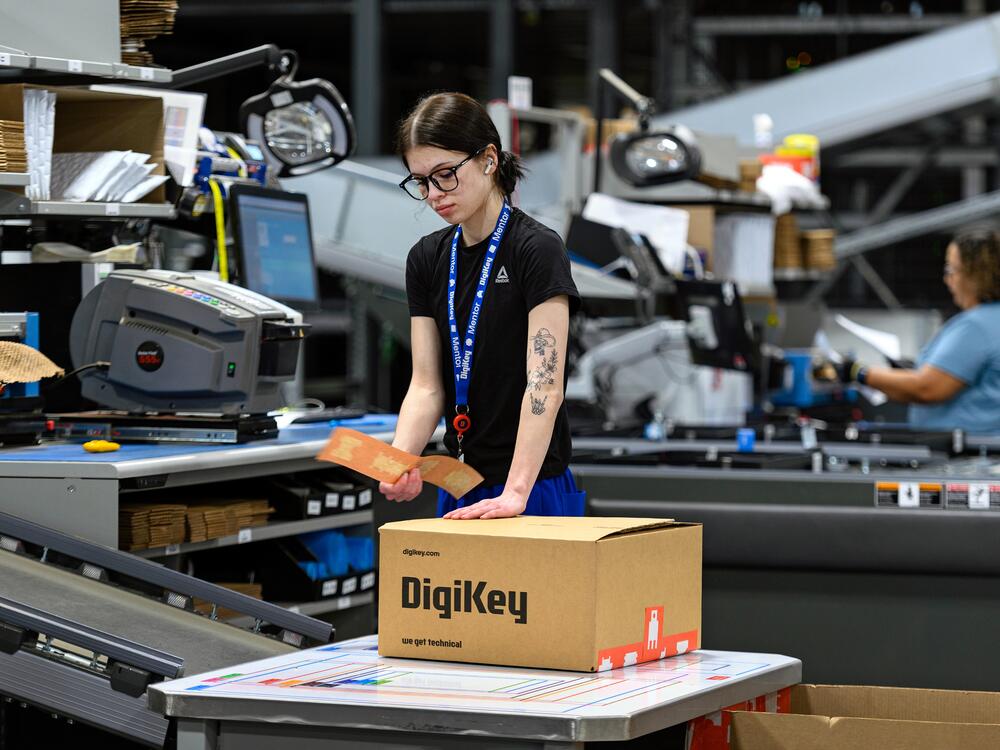 A DigiKey employee prepares an order of electronic components for shipment.