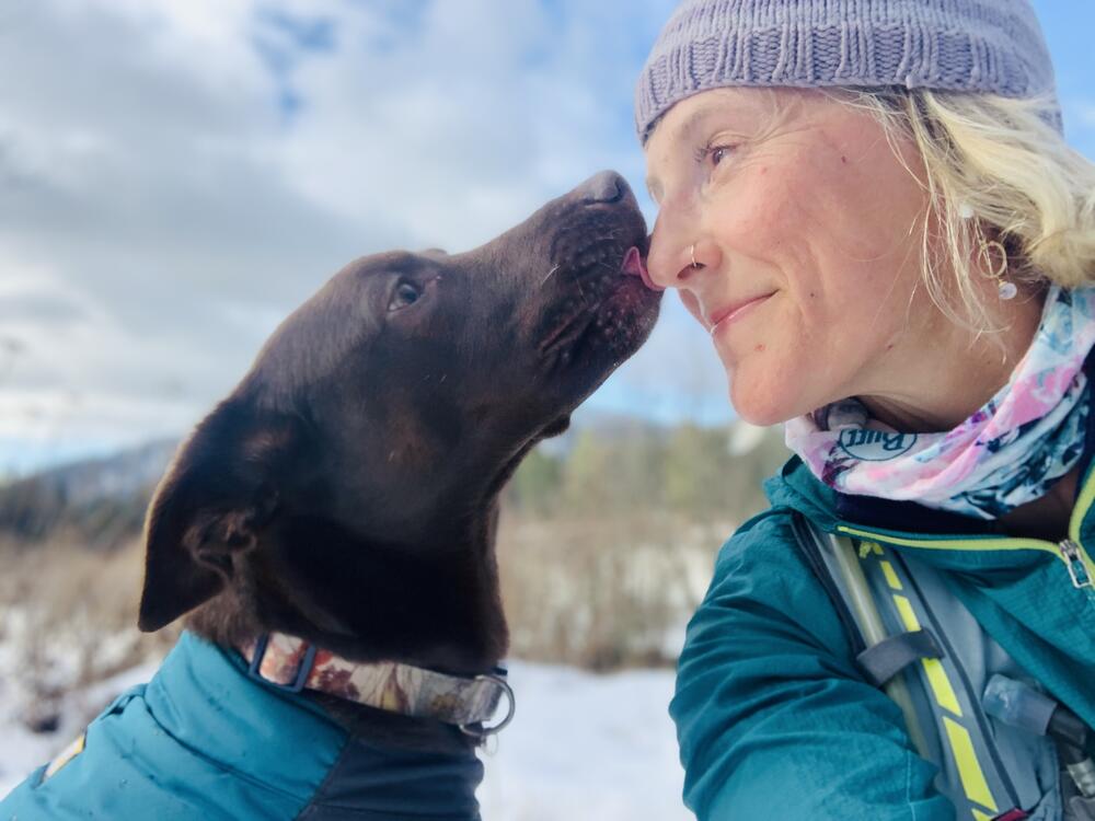 Freya the dog licks Ammi Midstokke's nose.