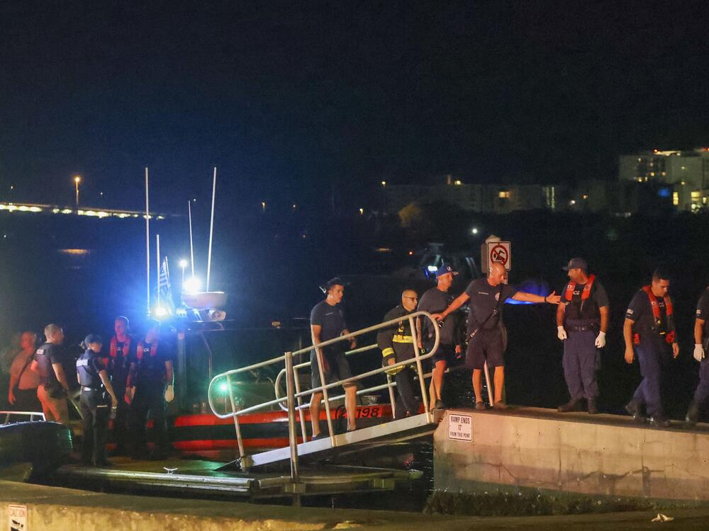 Rescue workers gather at the Seminole Boat ramp north of where a boat crashed into the ferry causing multiple injuries near the Clearwater Memorial Causeway Bridge, on Sunday, April 27, 2025, in Clearwater, Fla.