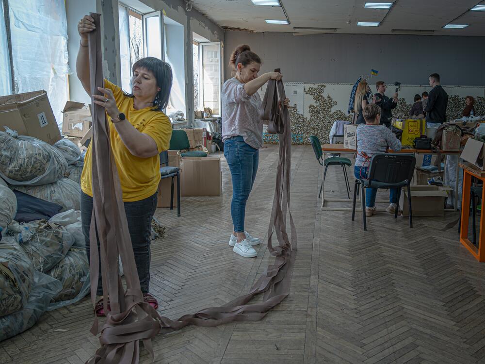 Displaced Ukrainians weave camouflage netting for the military in Zaporizhia Youth Center on March 19.