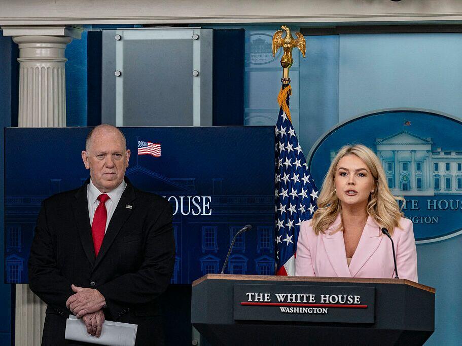 Press Secretary Karoline Leavitt (right) speaks as border czar Tom Homan looks on during a White House briefing on Monday.