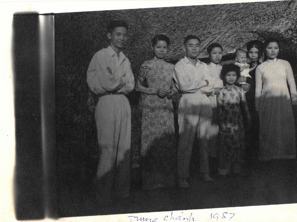 Eleven-year-old Gia Thi Pham, Philippa Hughes' mother, front row, pictured in a family photo in Vietnam in 1957.