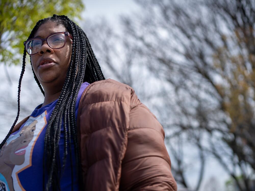 Tracey Malone, executive director of the Sandtown-Winchester Community Collective, stands outside a shuttered recreation center in Baltimore.