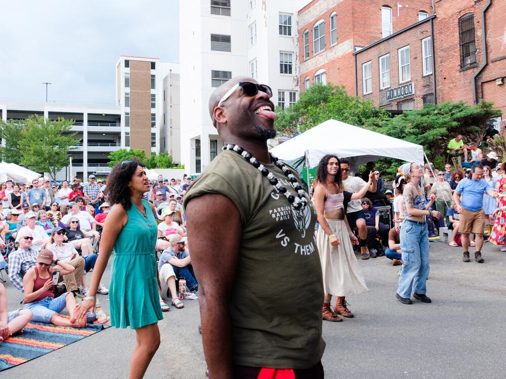 Durham, N.C. - April 26th, 2025: Attendees watch and dance as New Dangerfield performs during the Biscuit and Banjos festival. (Cornell Watson for NPR)