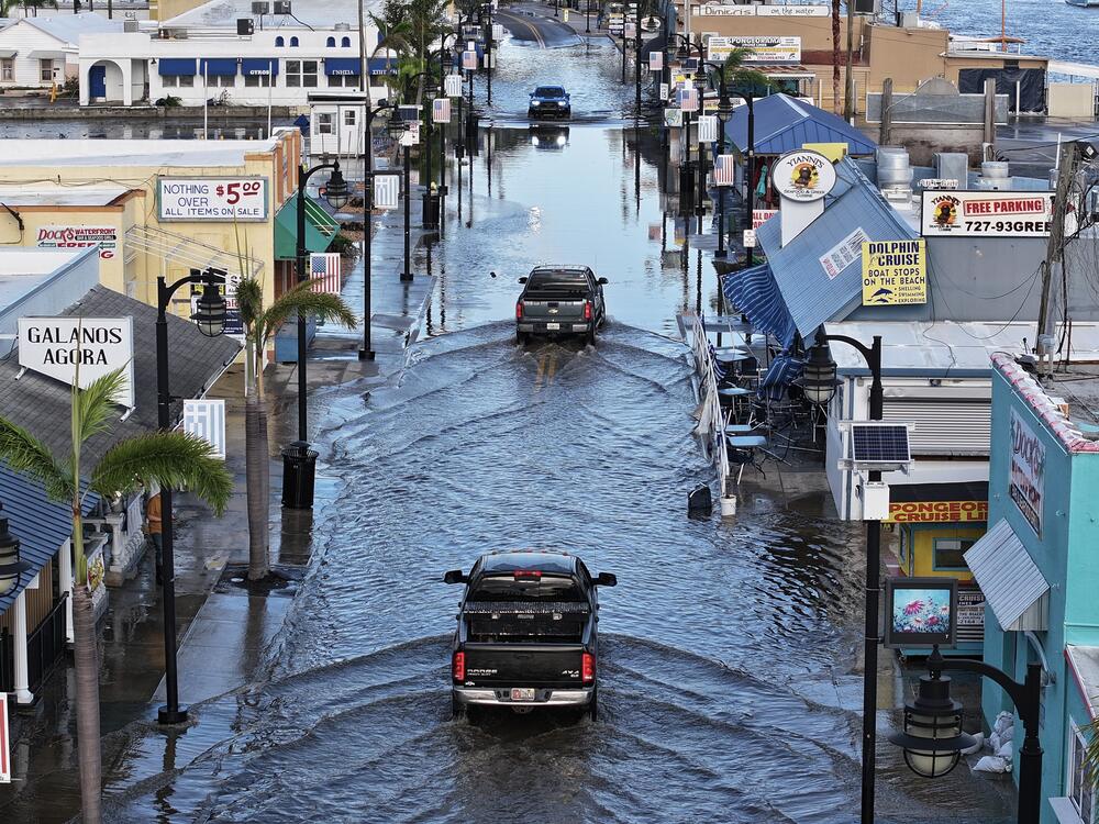 Flood waters in Tarpon Springs, Fla., after Hurricane Helene passed offshore in September 2024. Sea level rise due to climate change means coastal flooding is worse, and happens more often. The White House has dismissed approximately 400 scientists and other climate experts who were working on a major report about how climate change affects the U.S.