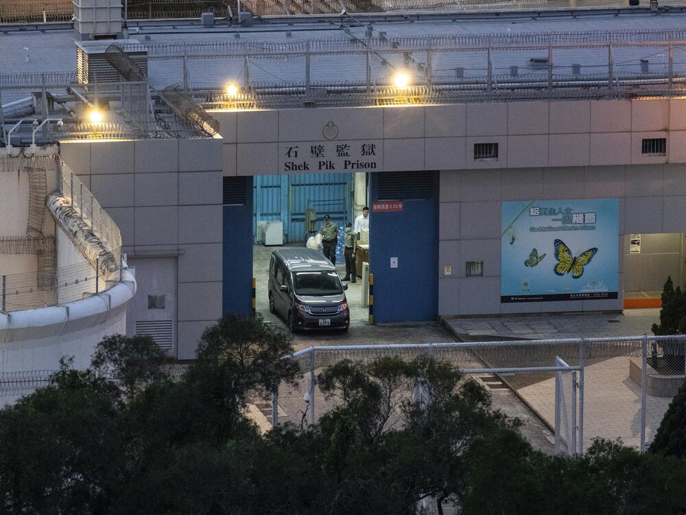 Vehicles believed to be carrying former pro-democracy lawmaker Gary Fan, who was released after four years for his conviction under the national security law, leaves the Shek Pik Prison in Hong Kong on Tuesday.