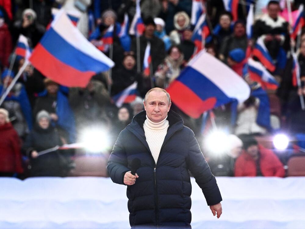 Russian President Vladimir Putin attends a concert marking the eighth anniversary of Russia's annexation of Crimea at the Luzhniki stadium in Moscow on March 18, 2022, just weeks after Moscow's full-scale invasion of Ukraine.