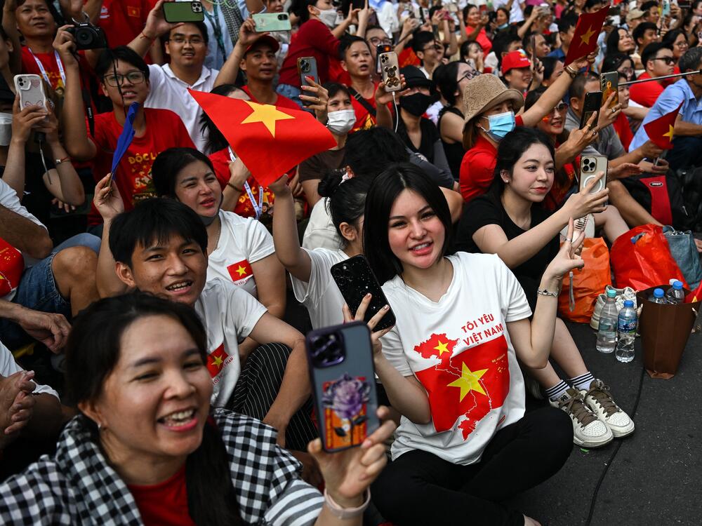 Spectators cheer as Chinese soldiers march during a parade marking the 50th anniversary of the fall of Saigon and the end of the Vietnam War in Ho Chi Minh City on April 30, 2025.