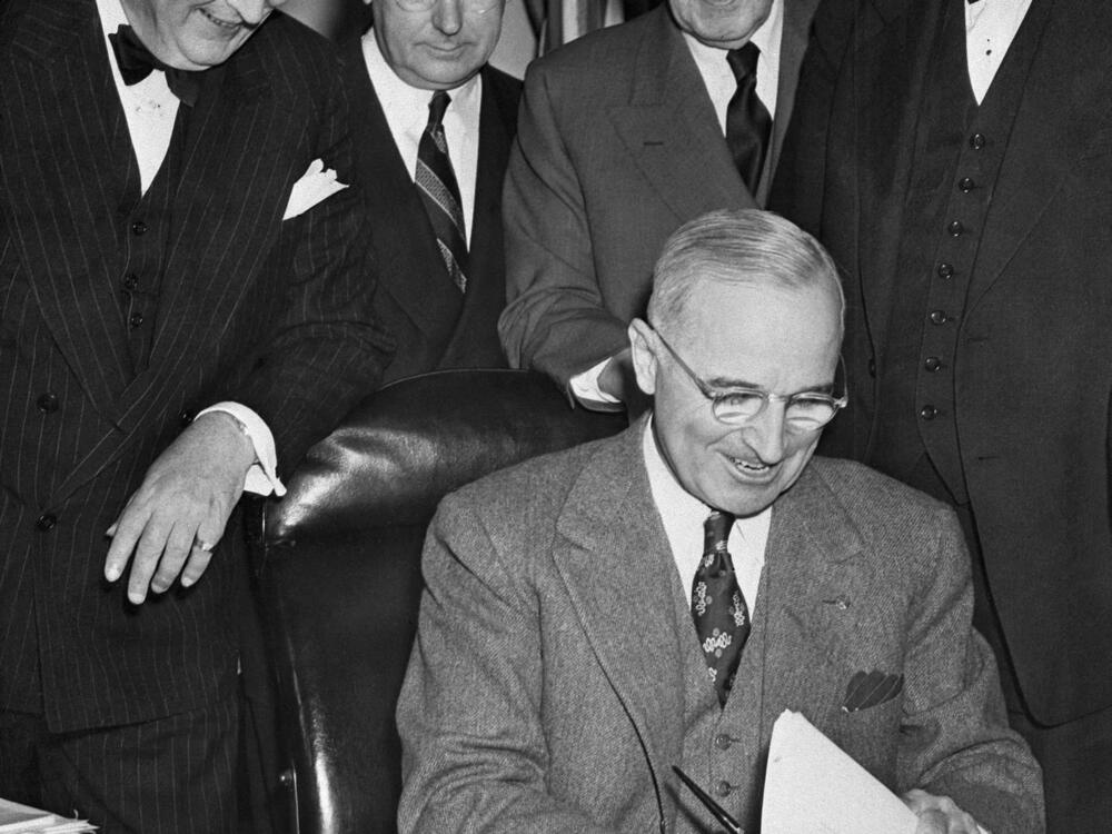 President Harry Truman signs the Marshall Plan on April 3, 1948, in Washington. The plan played a key role in the reconstruction of Europe after World War II and was part of the wide-ranging moves by the U.S. to establish a new international order that still defines the world to this day.