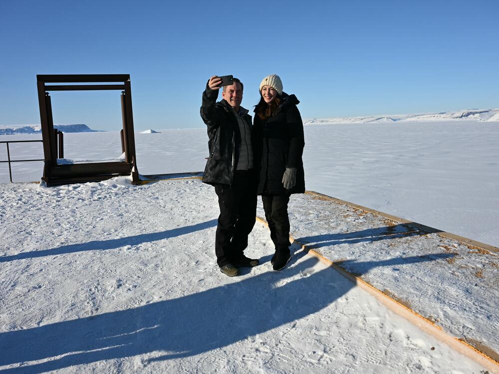 National security adviser Mike Waltz and his wife, former homeland security adviser Julia Nesheiwat, take a selfie as they tour the Pituffik Space Base on March 28, 2025 in Greenland during a visit with Vice President Vance.