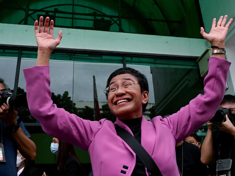 Maria Ressa gestures after she and her online news outfit Rappler were acquitted of tax evasion cases against her at the Court of Tax Appeals in Quezon City, Metro Manila, in January 2023.