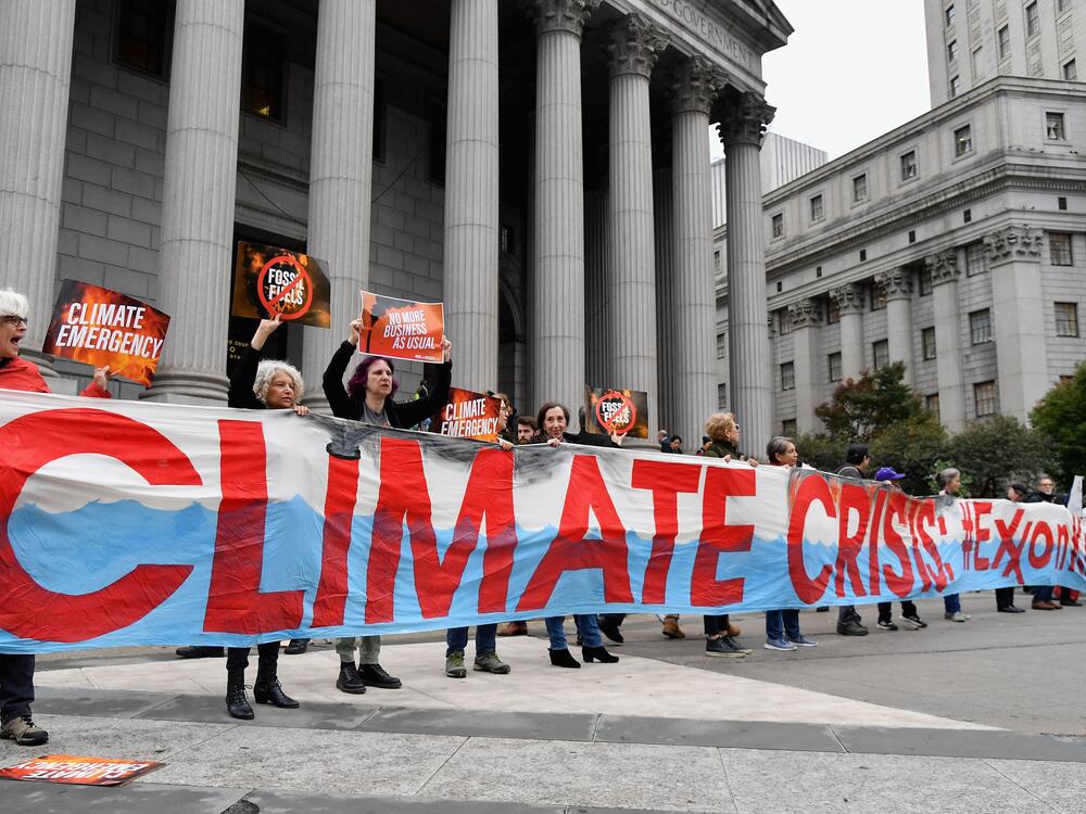 Climate activists protest on the first day of an ExxonMobil trial outside the New York State Supreme Court building in 2019 in New York City. Justice Barry Ostrager of the New York State Supreme Court ultimately found that the New York Attorney General's Office failed to prove that ExxonMobil broke the law.