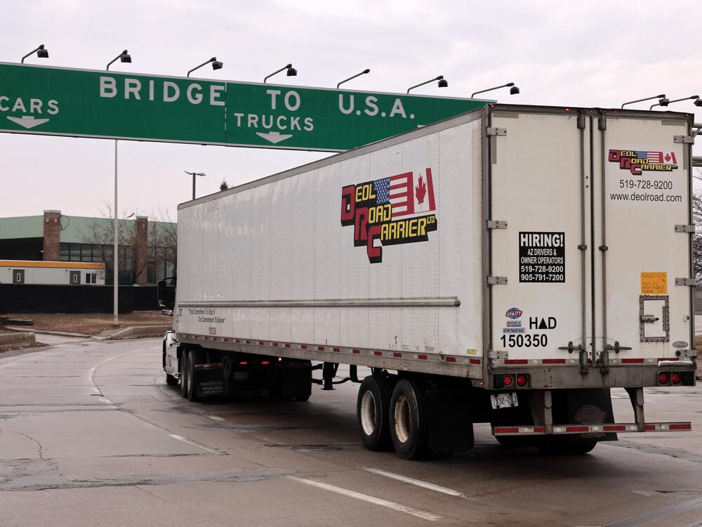 A truck is about to cross the Ambassador Bridge in Windsor, Ontario to go to Detroit, Mich. on Feb. 3, 2025. The economy shrank in the first quarter of the year as President Trump's tariffs, including on Canada, are sparking recession fears.