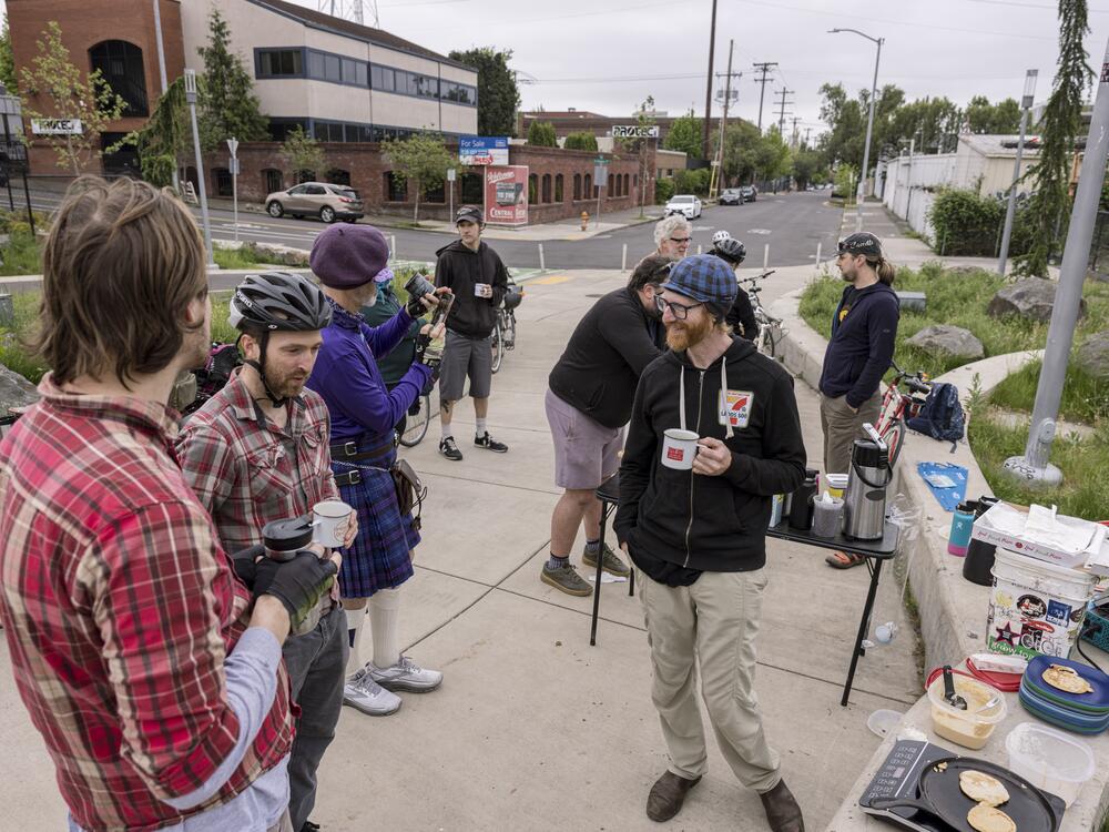 Lance Poehler (blue cap), is one of the organizers for the Blumenauer Bridge breakfast. While coffee and breakfast are appreciated, many stop for the community.