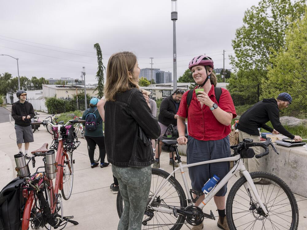 Bicycle commuters stop to grab a cup of coffee and a chat on their way into work as part of Portland's 
