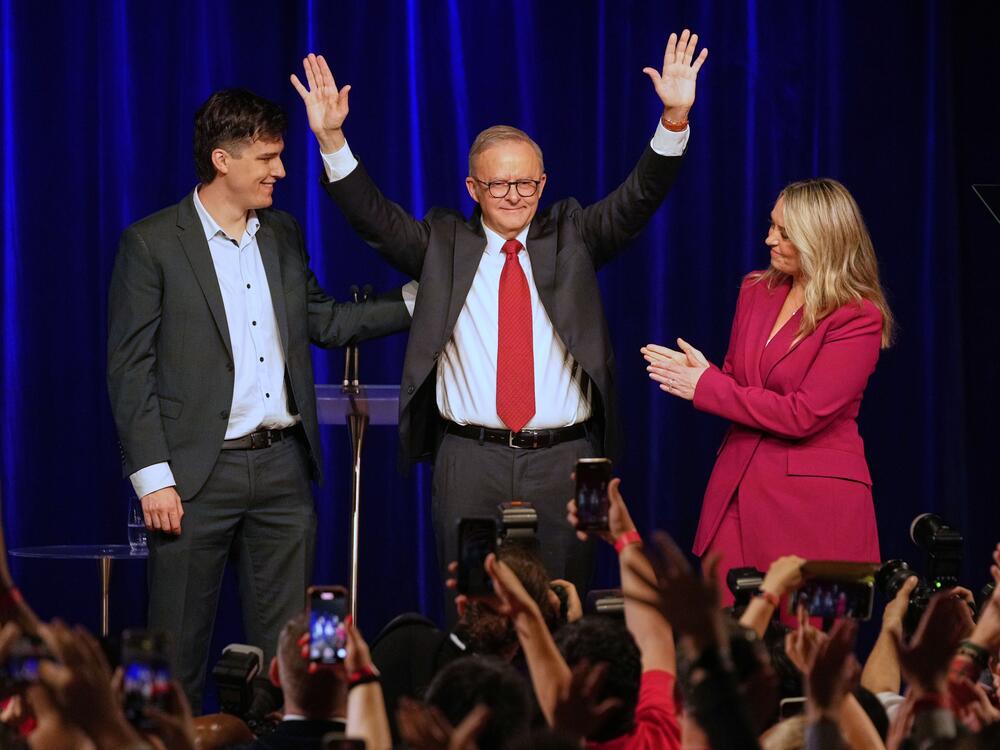 Australian Prime Minister Anthony Albanese (center), his partner Jodie Haydon and son Nathan react as they meet the party faithful after winning a second term following the general election in Sydney on Saturday.