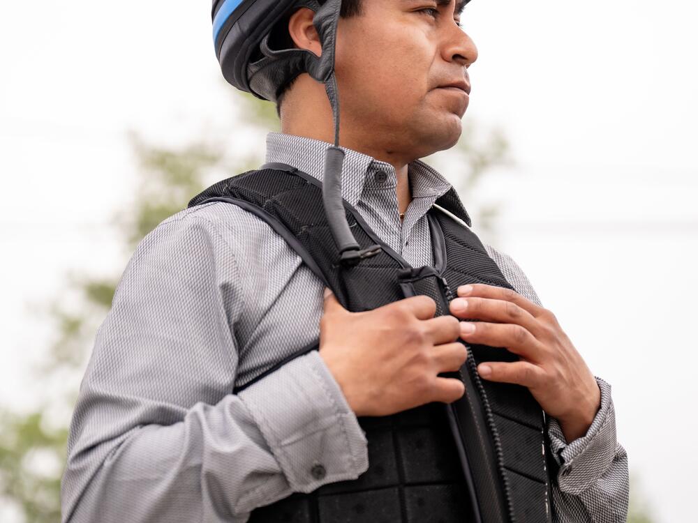 Martin Garcia (40), a jockey from Veracruz, Mexico, discusses his experiences riding in competitions on the backside of a horse racing track in Louisville, Ky., on April 30, 2025. Garcia entered the country 15 years ago and will be competing in his fourth Kentucky Derby.