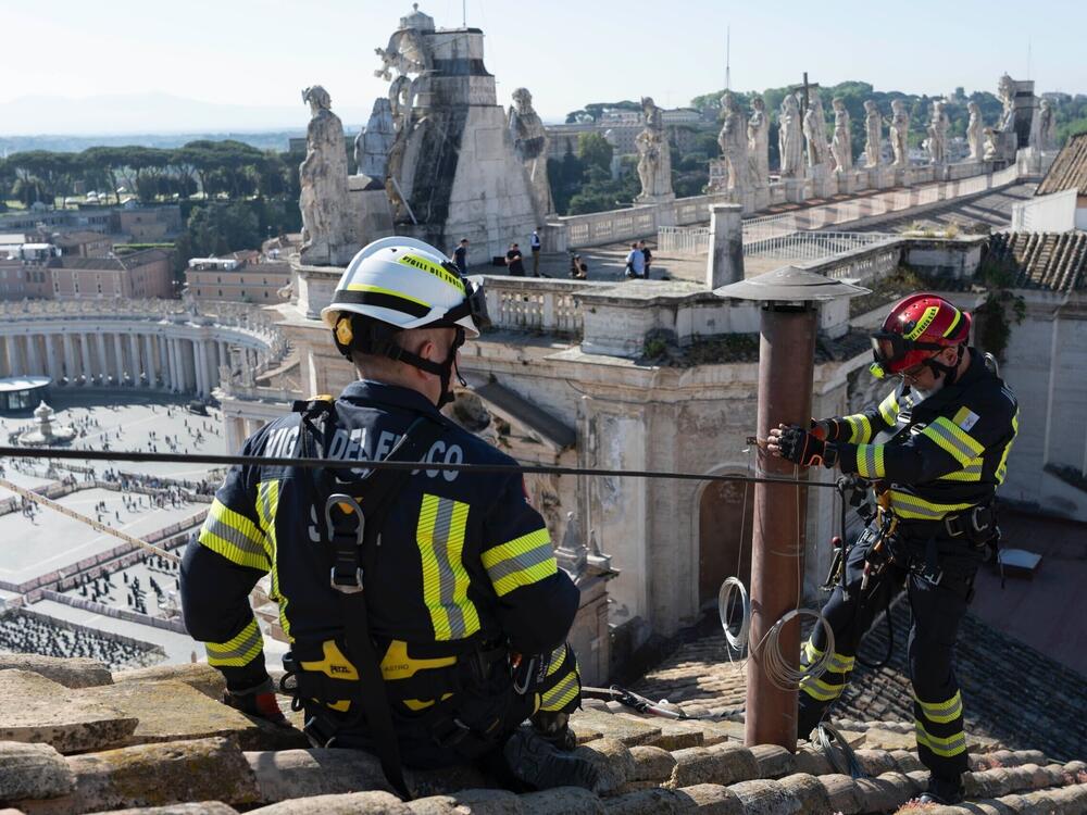 Workers have completed the installation of the chimney on top of the Vatican building in Rome, Italy. The color of the chimney smoke will give hints to the public about how the papal selection process is going.