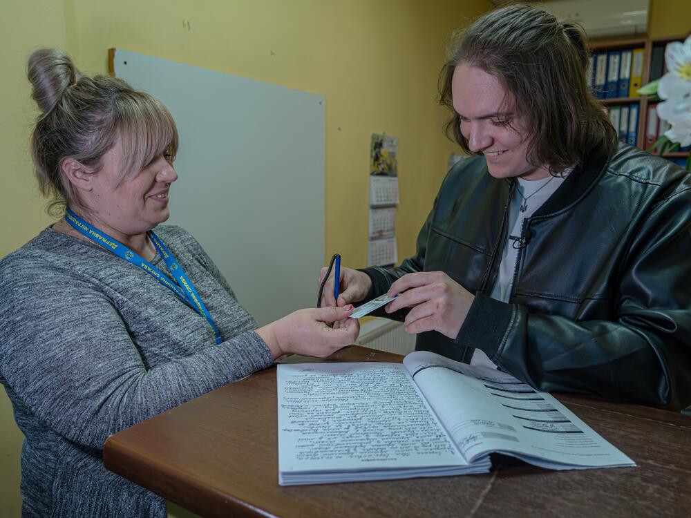 Ivan Sarancha receives his Ukrainian national ID card in the Kyiv region.