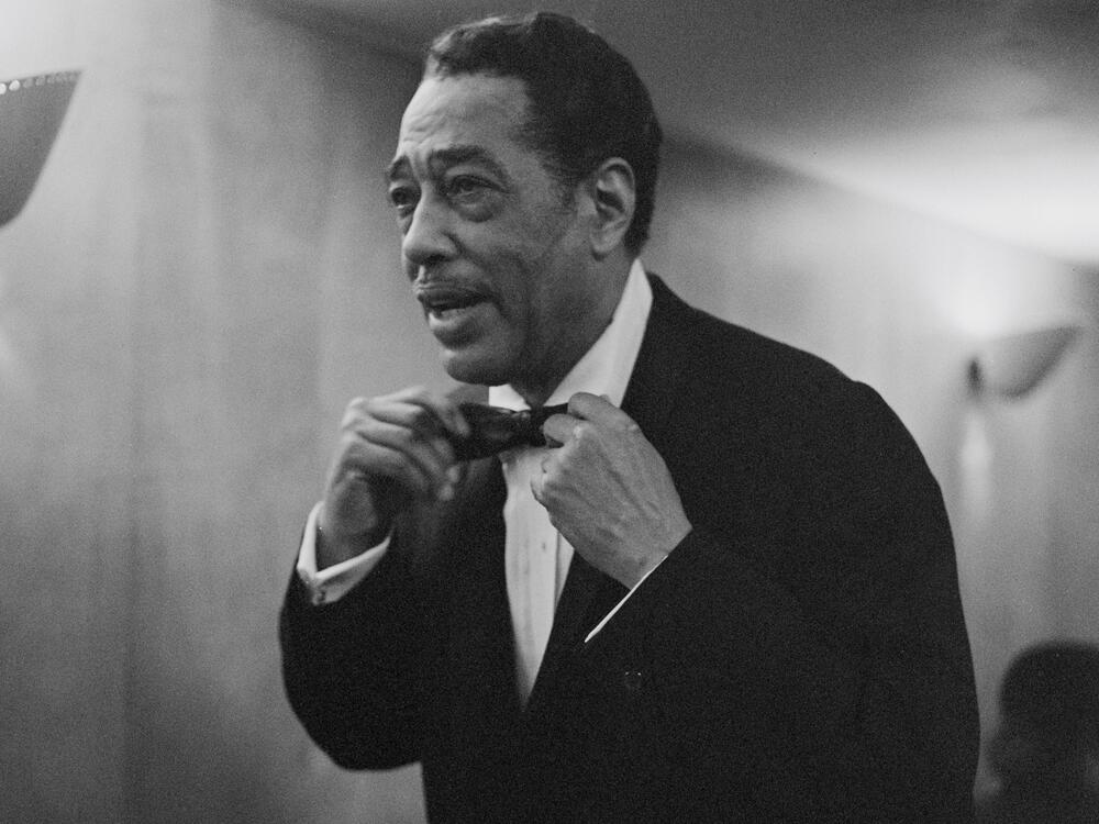 Composer and band leader Duke Ellington adjusting his bow-tie at the Royal Festival Hall in London on October 5th, 1958.