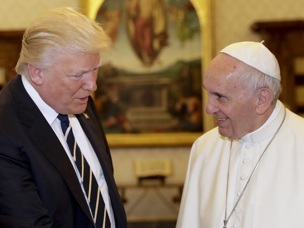 President Trump is pictured at the Vatican in 2017 with Pope Francis, who died last month.  Trump posted on social media Friday what appears to be an AI-generated image of himself dressed as the pope.