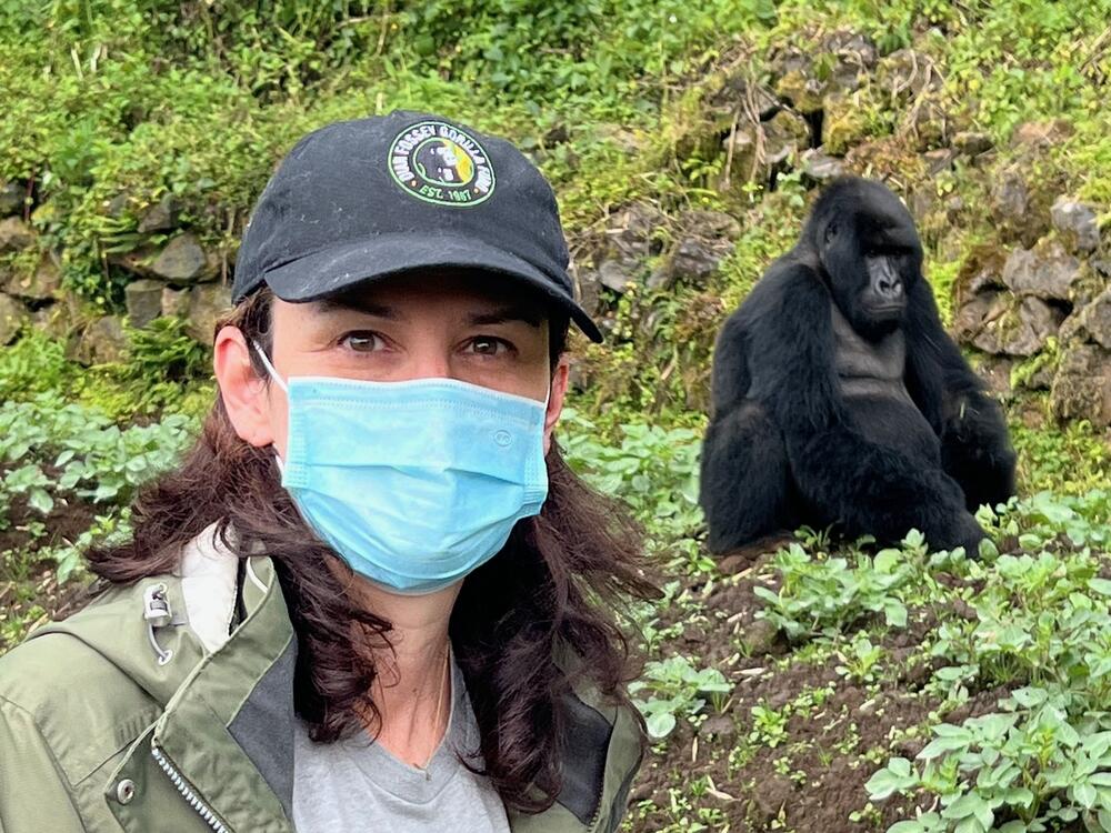 Tara Stoinski poses with a gorilla.