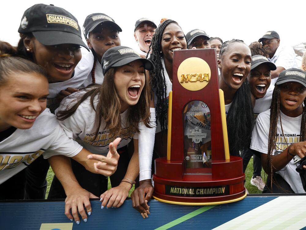 University of Florida athletes celebrate the women's team title during the NCAA Division 1 Outdoor Track & Field Championships on June 11, 2022. Under a proposed legal settlement, many athletes on track and field, swimming and other collegiate sports could see their roster spots eliminated.